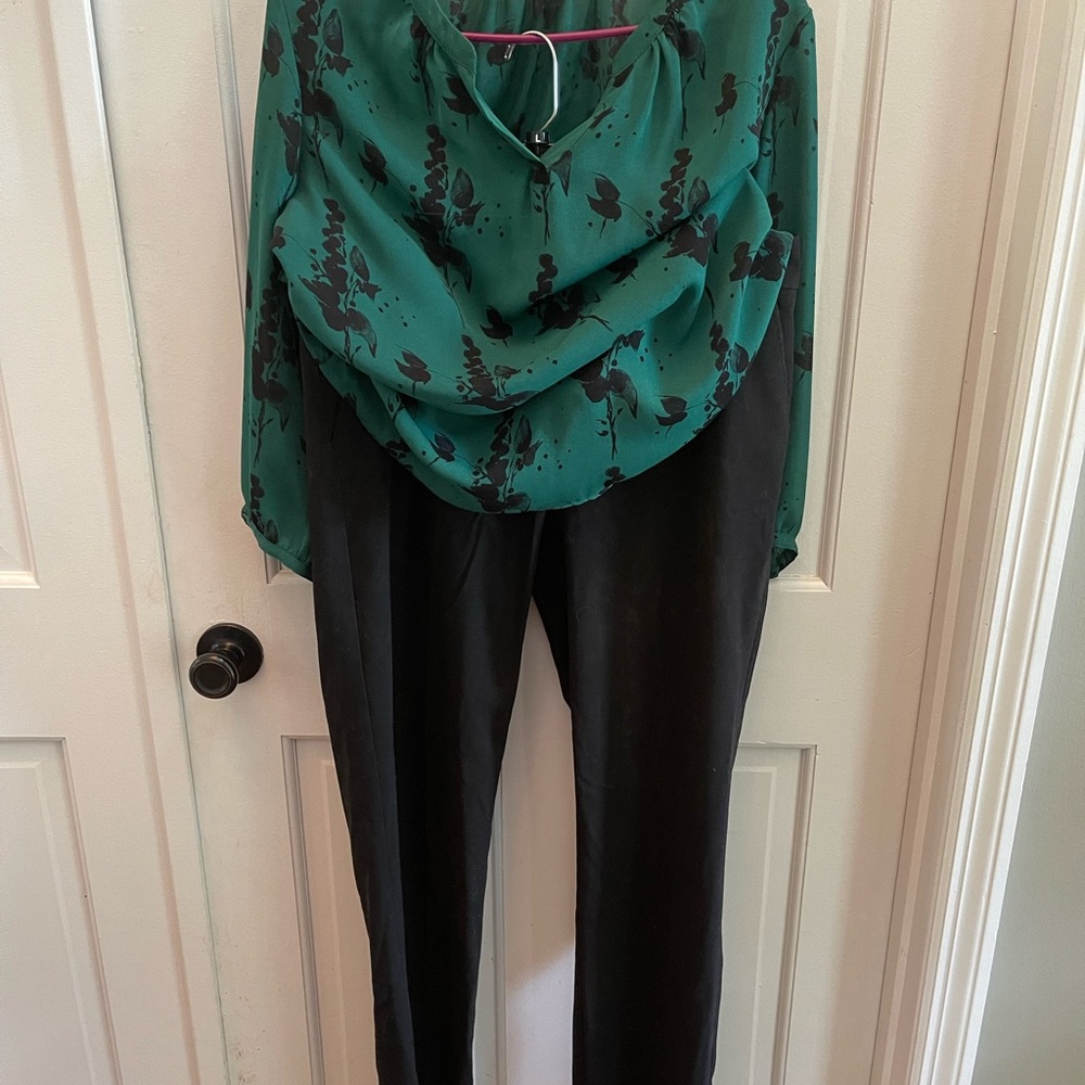 Straight leg black pants with complimentary green and black blouse.